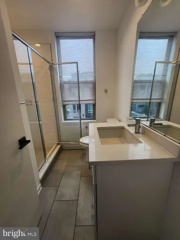 a bathroom with a sink a mirror and a bathtub
