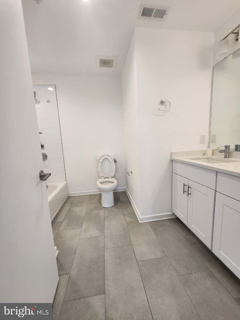3129 Beachview Lane Philadelphia, PA 19125 - Photo 20 of 26 a bathroom with a sink a toilet and a mirror