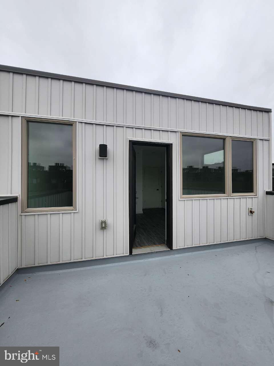 3129 Beachview Lane Philadelphia, PA 19125 - Photo 25 of 26 a view of a livingroom with an empty space and wooden floor