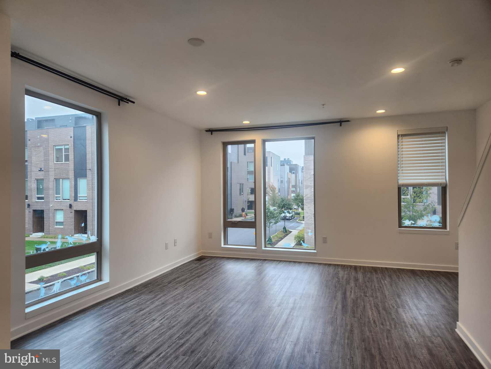 3129 Beachview Lane Philadelphia, PA 19125 - Photo 9 of 26 a view of an empty room with wooden floor and a window