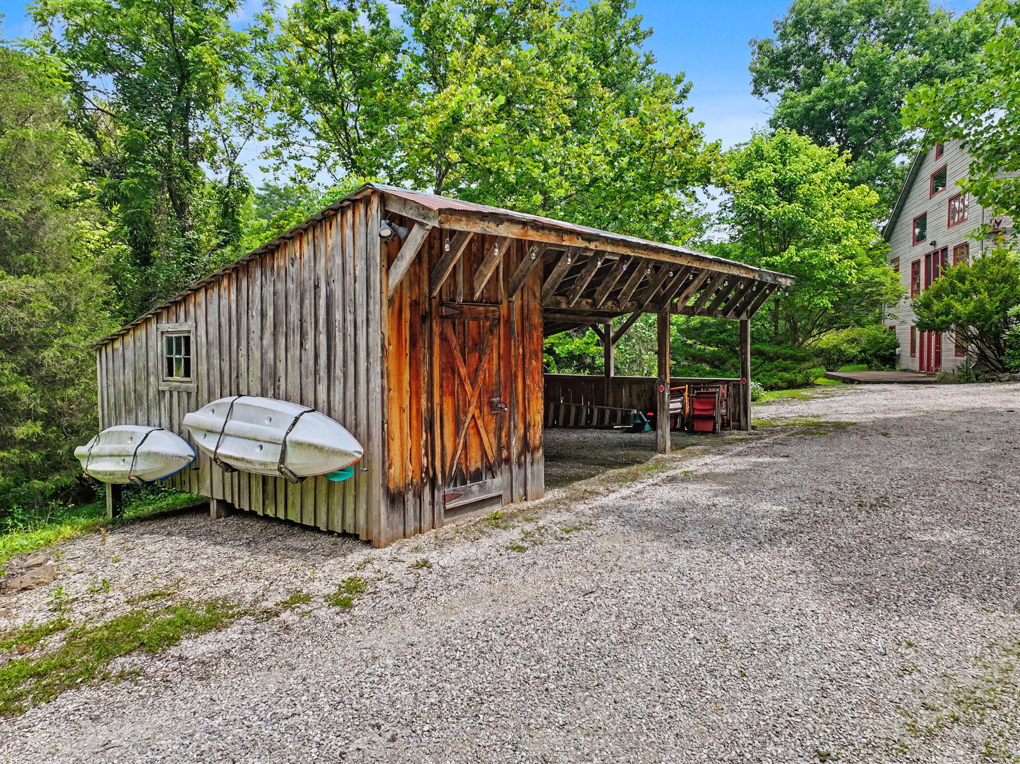 9766 Sullivan Road Union, KY 41091 - Photo 41 of 50 Carport with storage and kayak racks. Take your kayaks down to your private creek access and float your troubles away.