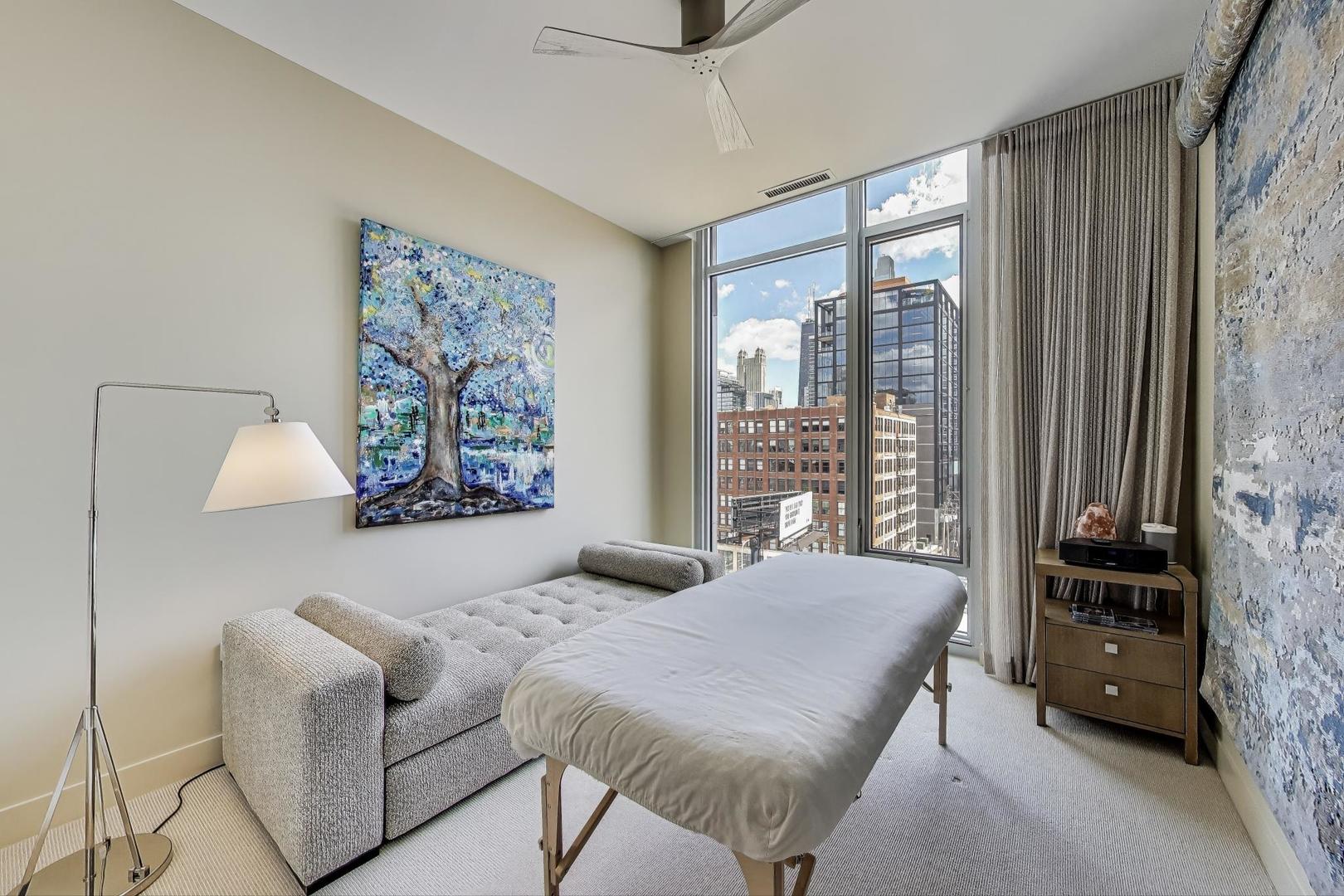 360 West Erie Street, Unit 7D Chicago, IL 60654 - Photo 23 of 39 a bedroom with furniture and a large window