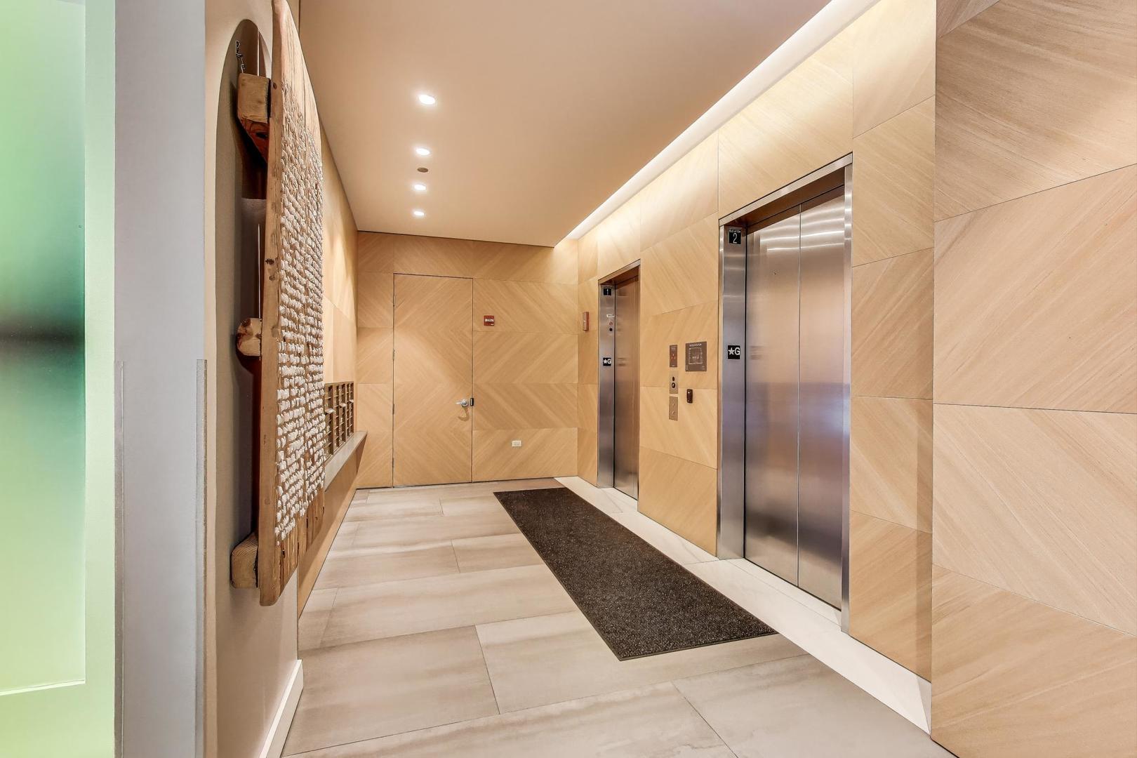 360 West Erie Street, Unit 7D Chicago, IL 60654 - Photo 39 of 39 a view of a hallway with wooden floor and staircase