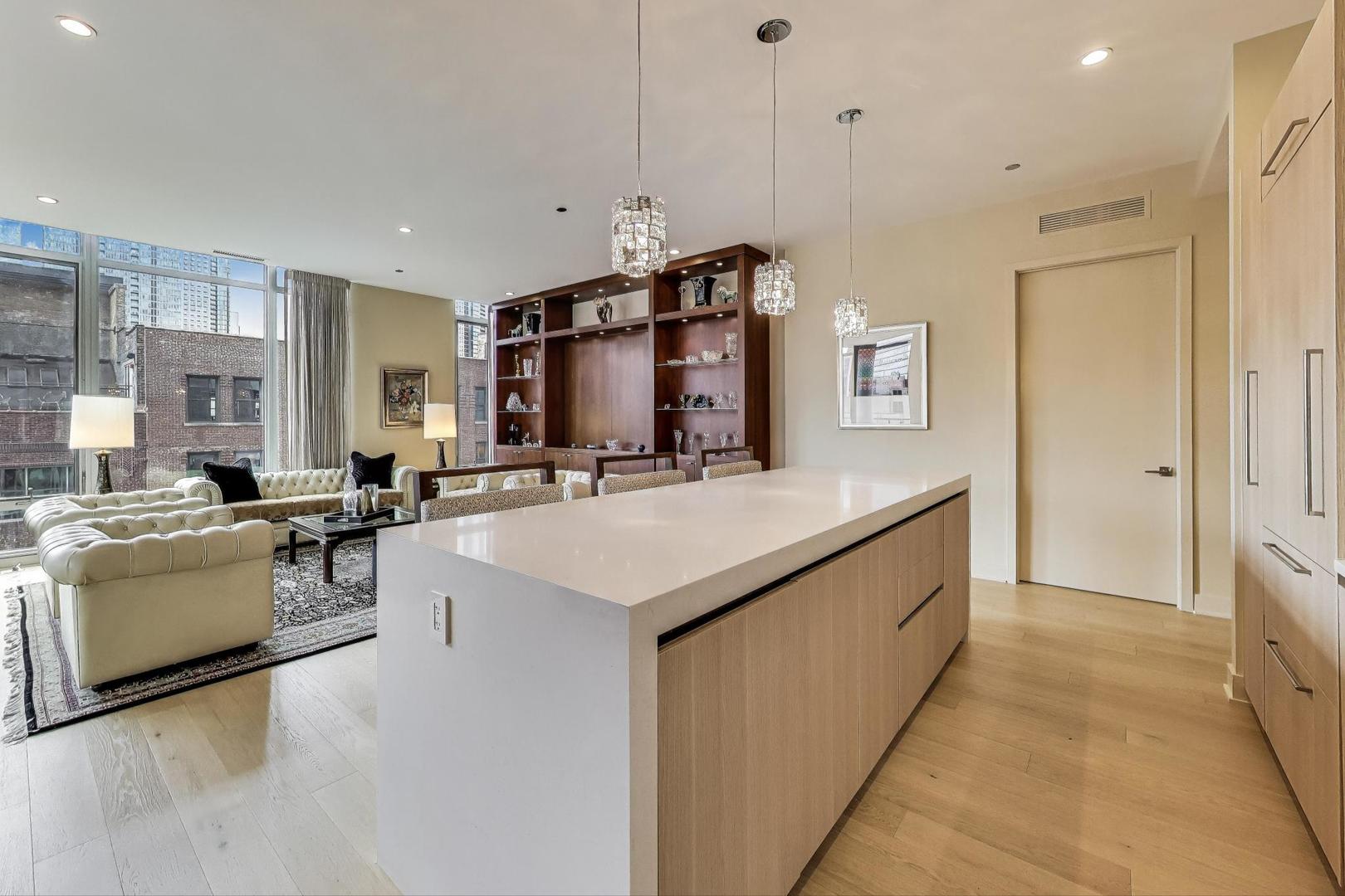 360 West Erie Street, Unit 7D Chicago, IL 60654 - Photo 7 of 39 a kitchen with stainless steel appliances a sink stove and refrigerator