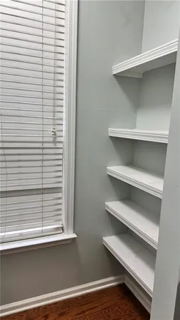 a bedroom with a bed and a walk in closet