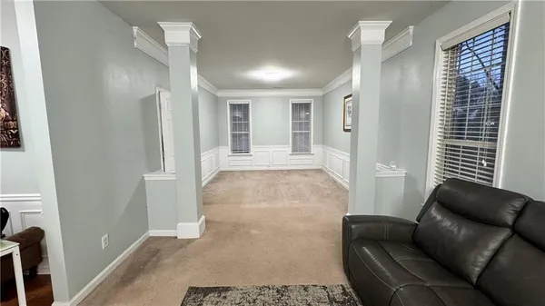 a living room with a sink and a mirror