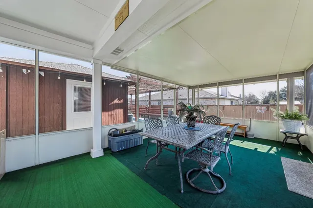 a view of a livingroom with furniture and garden