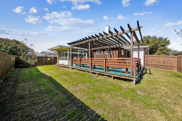 a view of a house with a yard porch and furniture