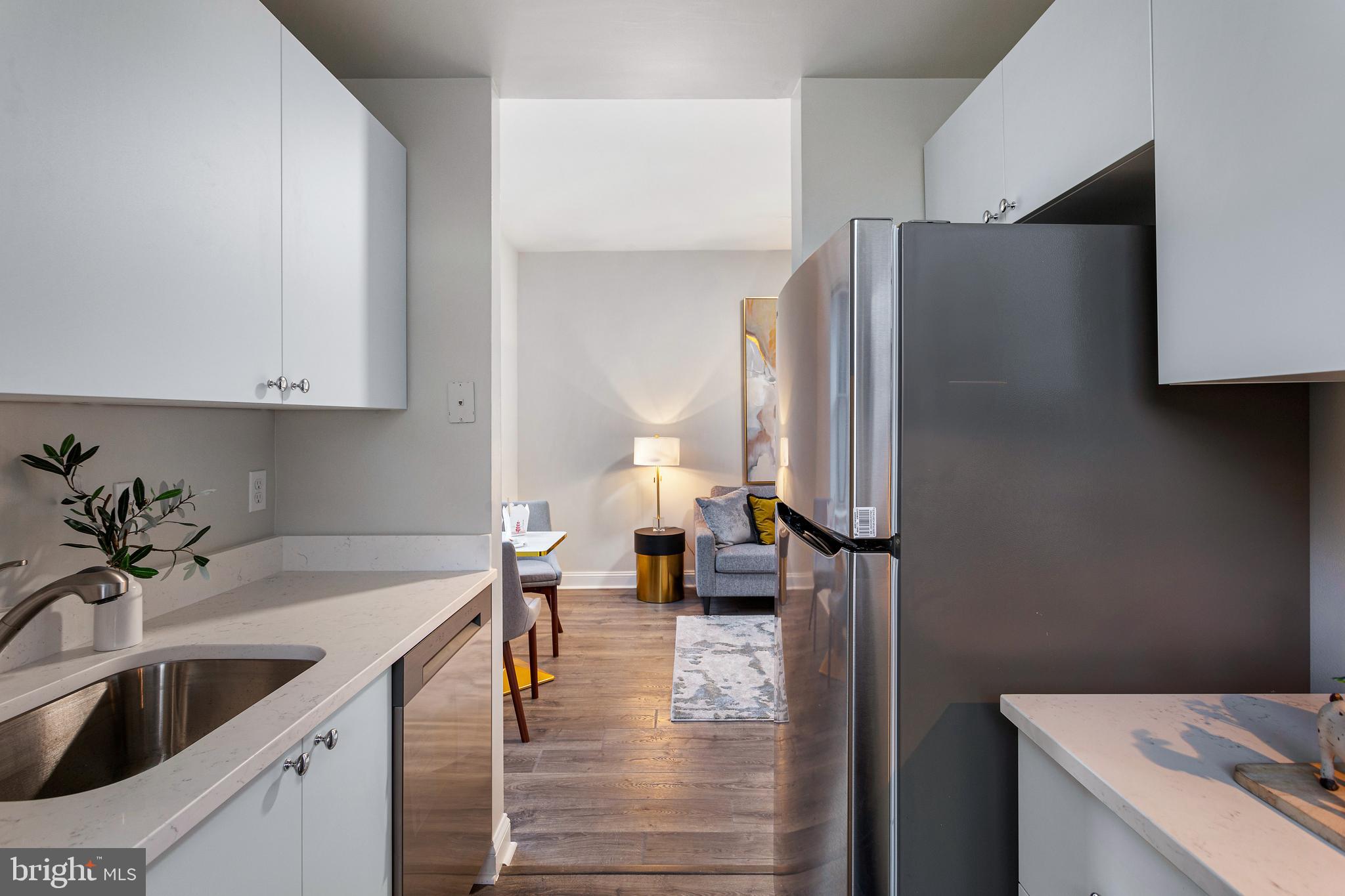 1621 T Street Northwest, Unit 305 Washington, DC 20009 - Photo 11 of 33 a kitchen with a sink and a refrigerator