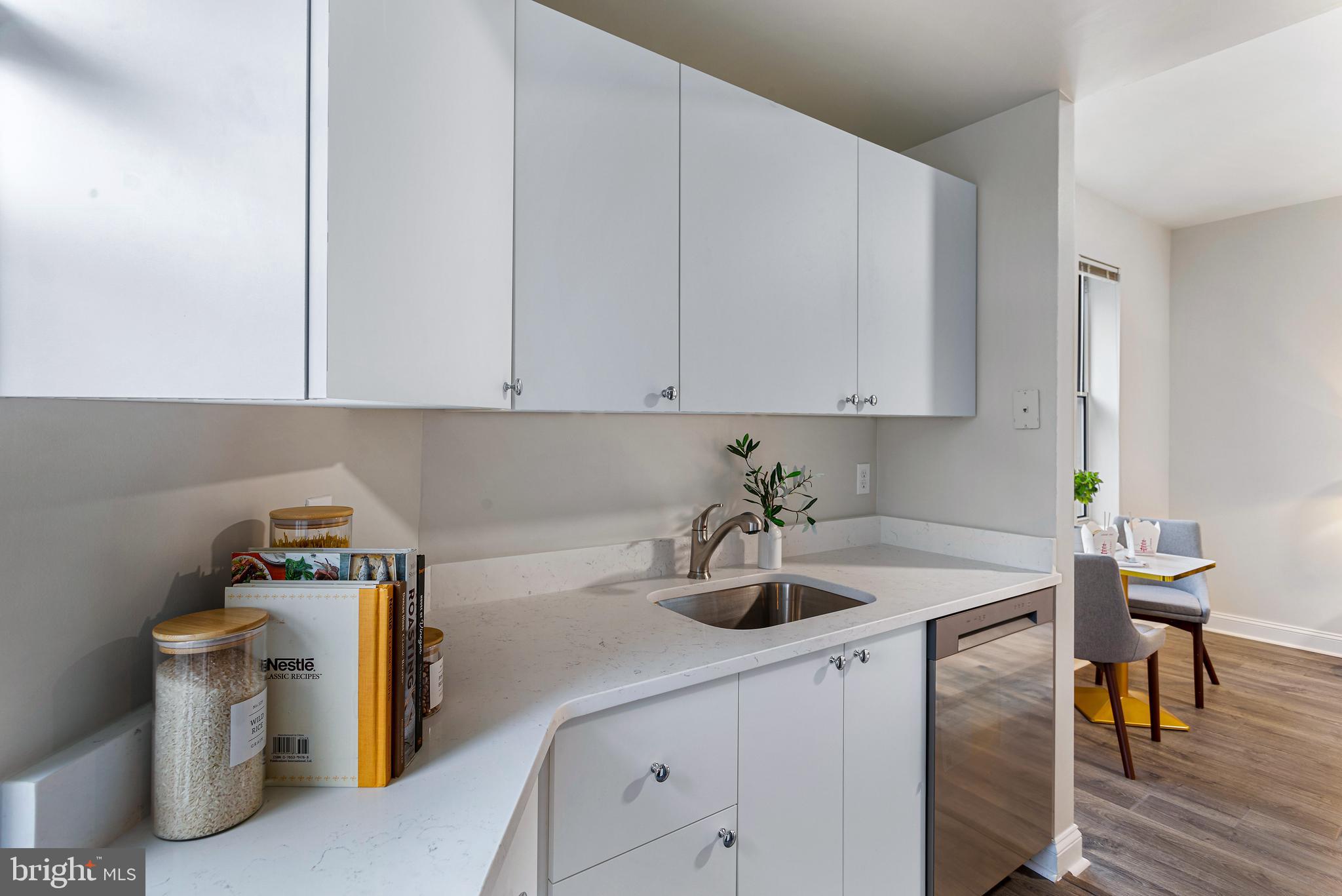 1621 T Street Northwest, Unit 305 Washington, DC 20009 - Photo 14 of 33 a kitchen with a sink cabinets and appliances