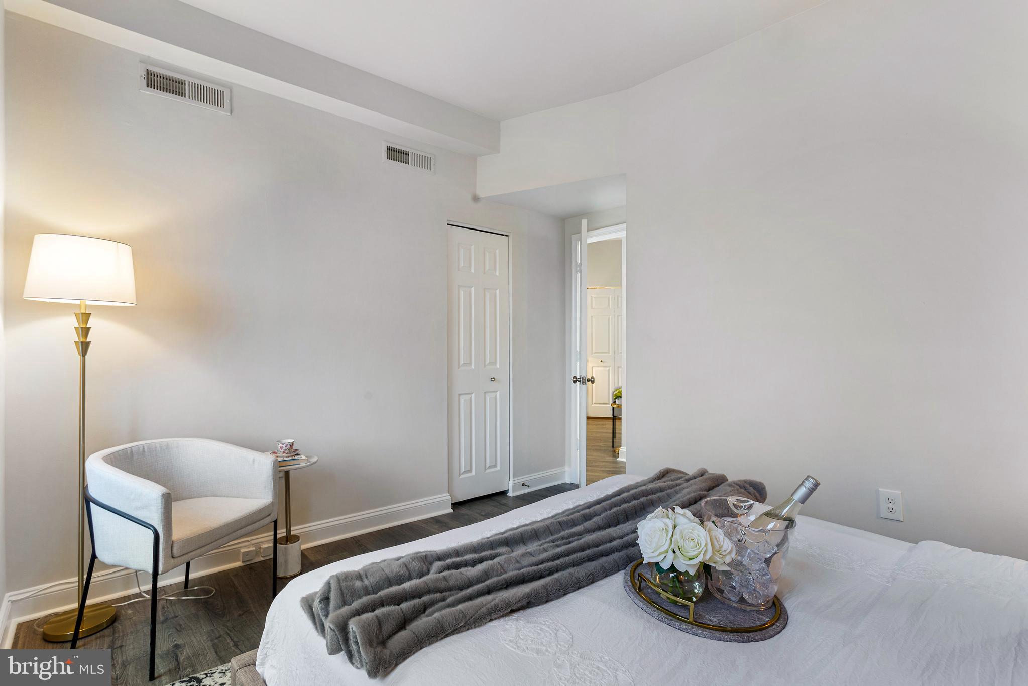 1621 T Street Northwest, Unit 305 Washington, DC 20009 - Photo 20 of 33 a bedroom with a bed and a lamp