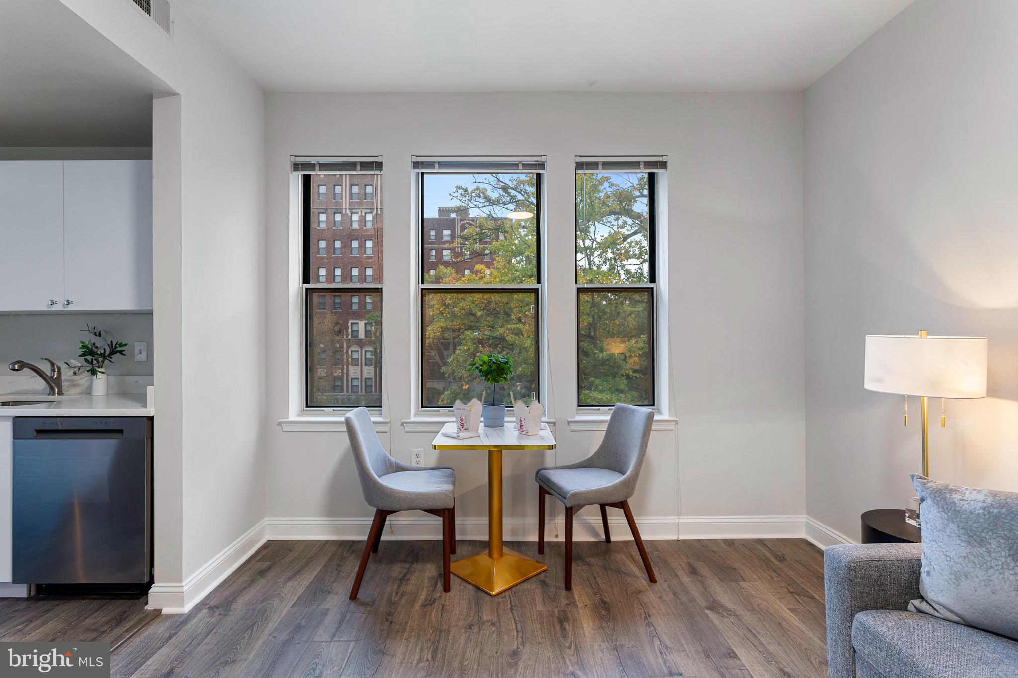 1621 T Street Northwest, Unit 305 Washington, DC 20009 - Photo 8 of 33 a dining room with furniture and wooden floor