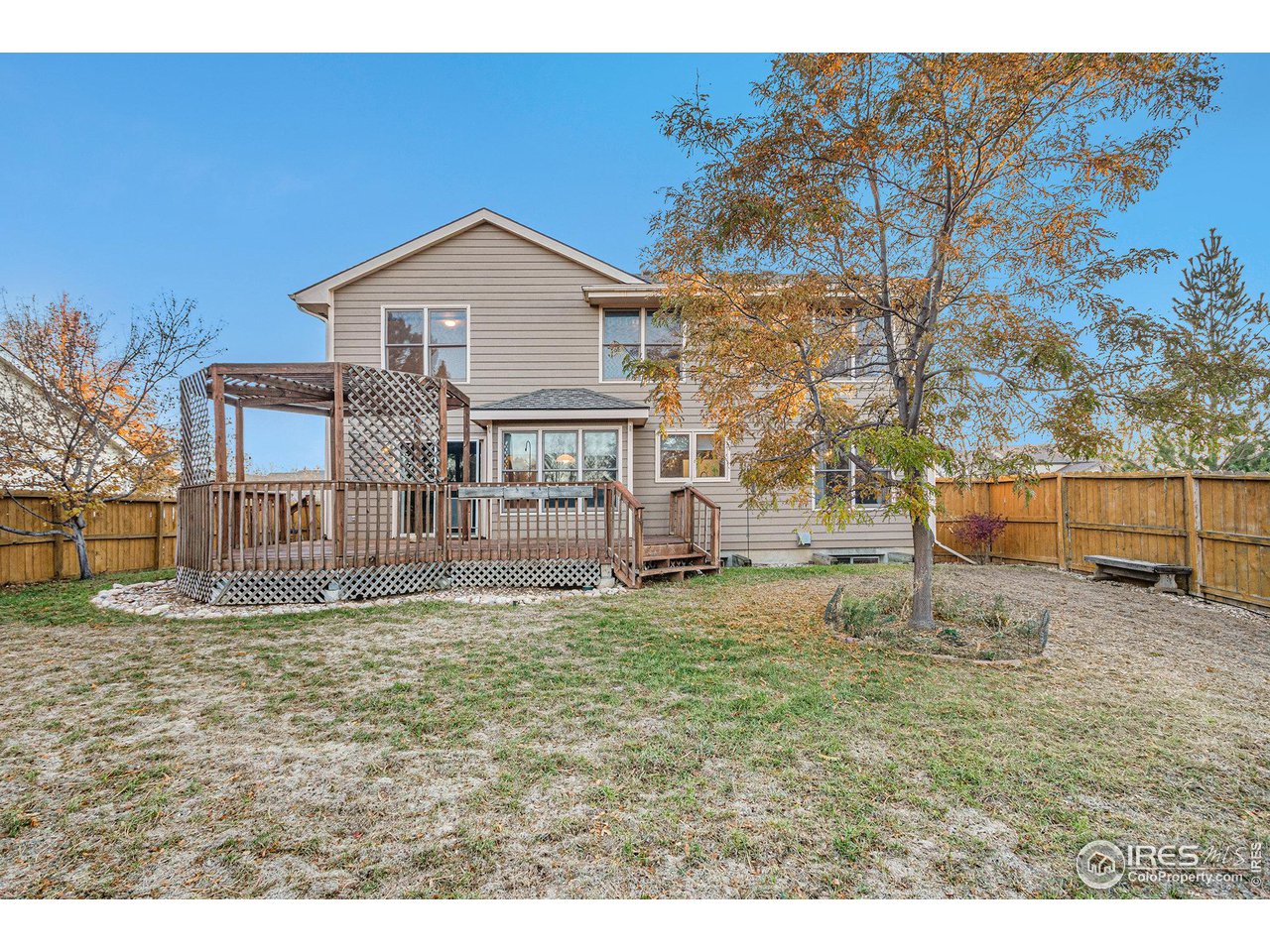 3000 Antelope Road Fort Collins, CO 80525 - Photo 29 of 31 Oversized lot is fully fenced and surrounded by mature evergreen trees for privacy. The perfect space for yard games or a BBQ!