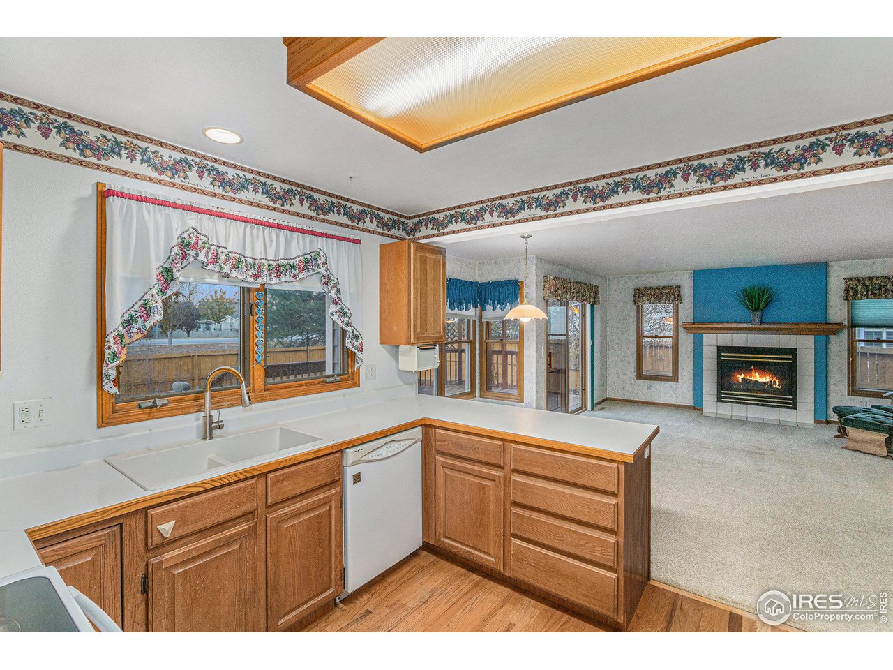 3000 Antelope Road Fort Collins, CO 80525 - Photo 10 of 31 Enjoy the openness from the kitchen to the inviting great room complete with cozy fireplace and breakfast nook.