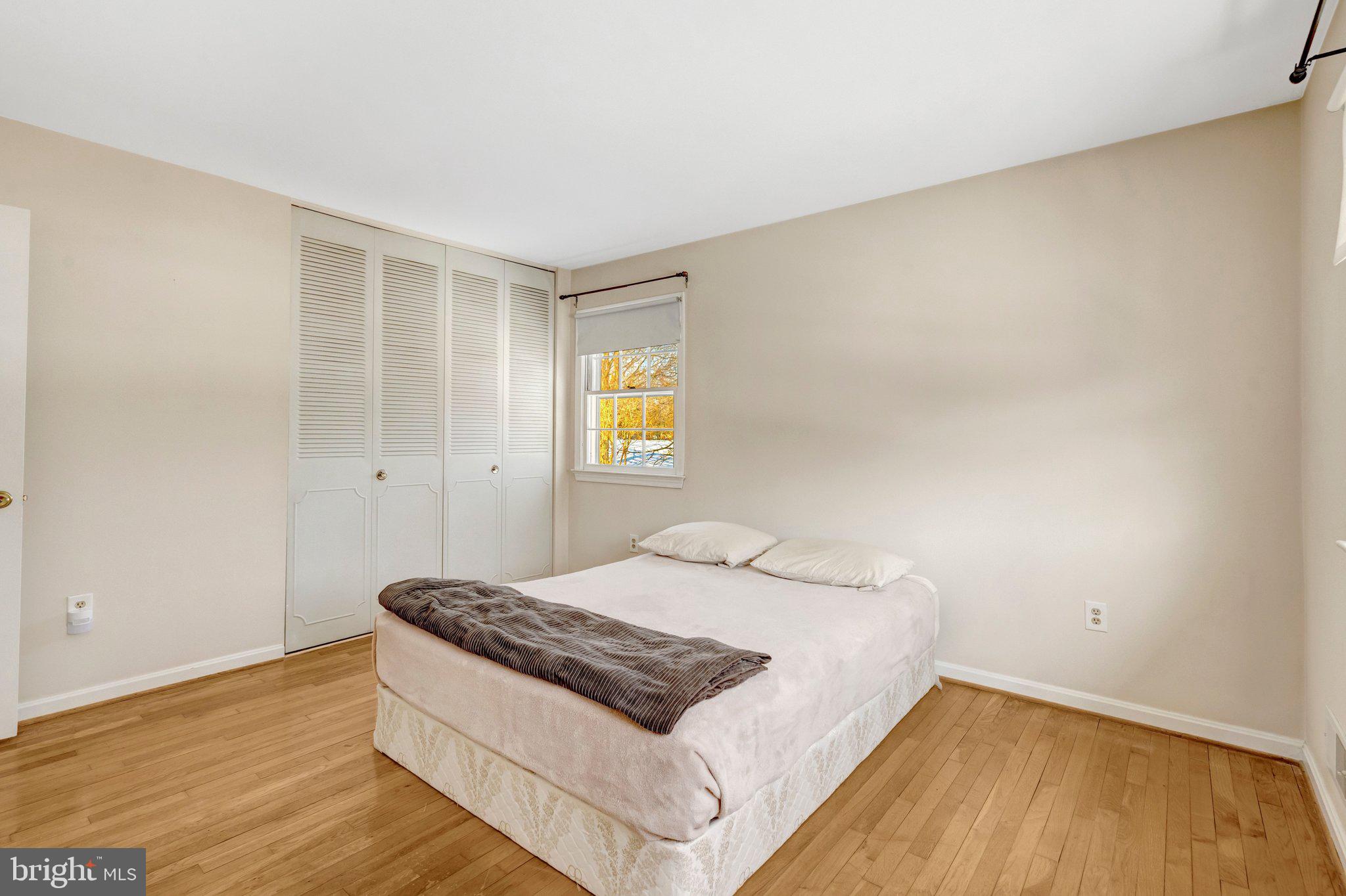 7413 Forrester Lane Manassas, VA 20109 - Photo 13 of 45 a bedroom with a bed and a window