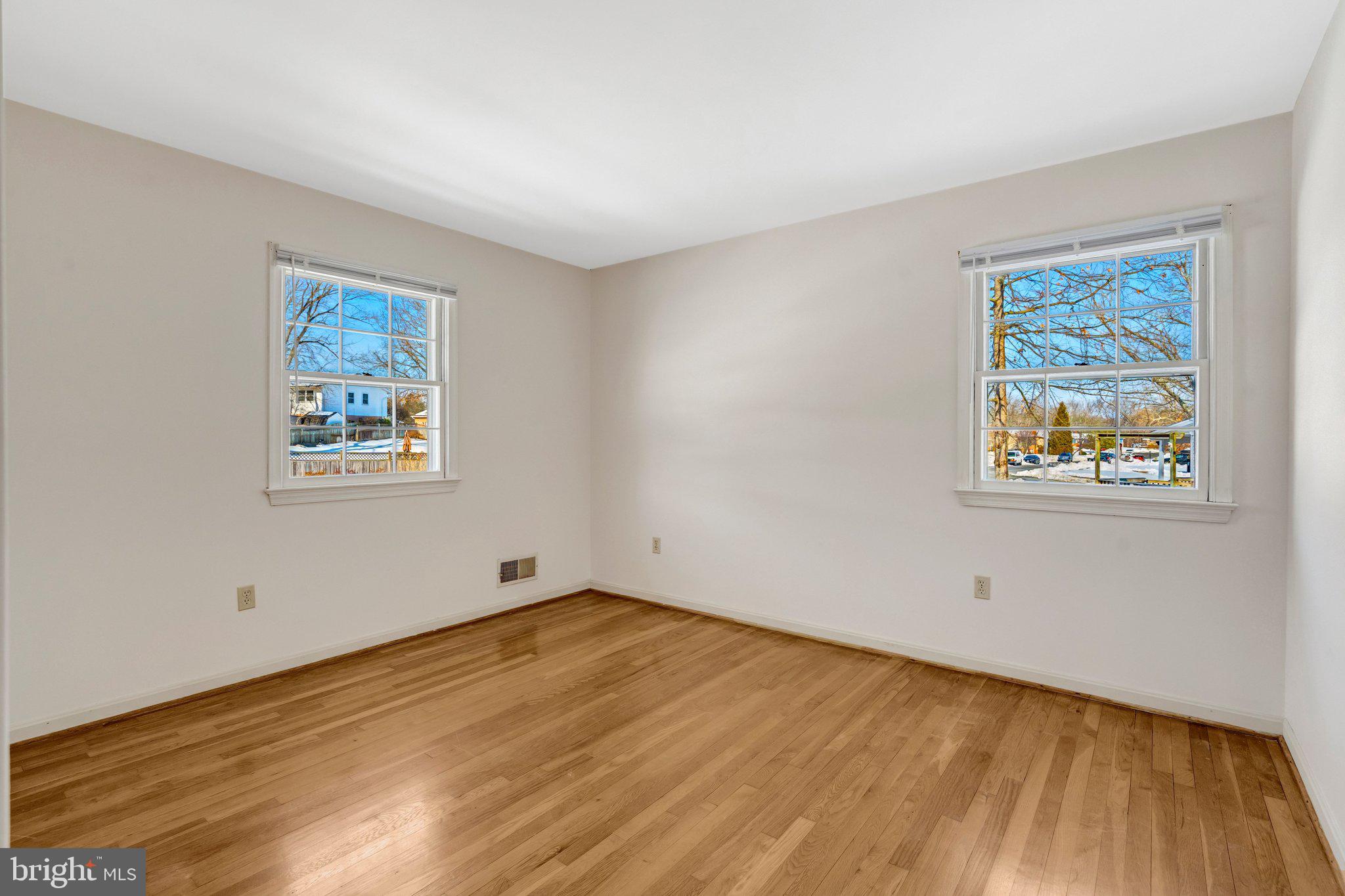 7413 Forrester Lane Manassas, VA 20109 - Photo 19 of 45 a view of empty room with wooden floor and window