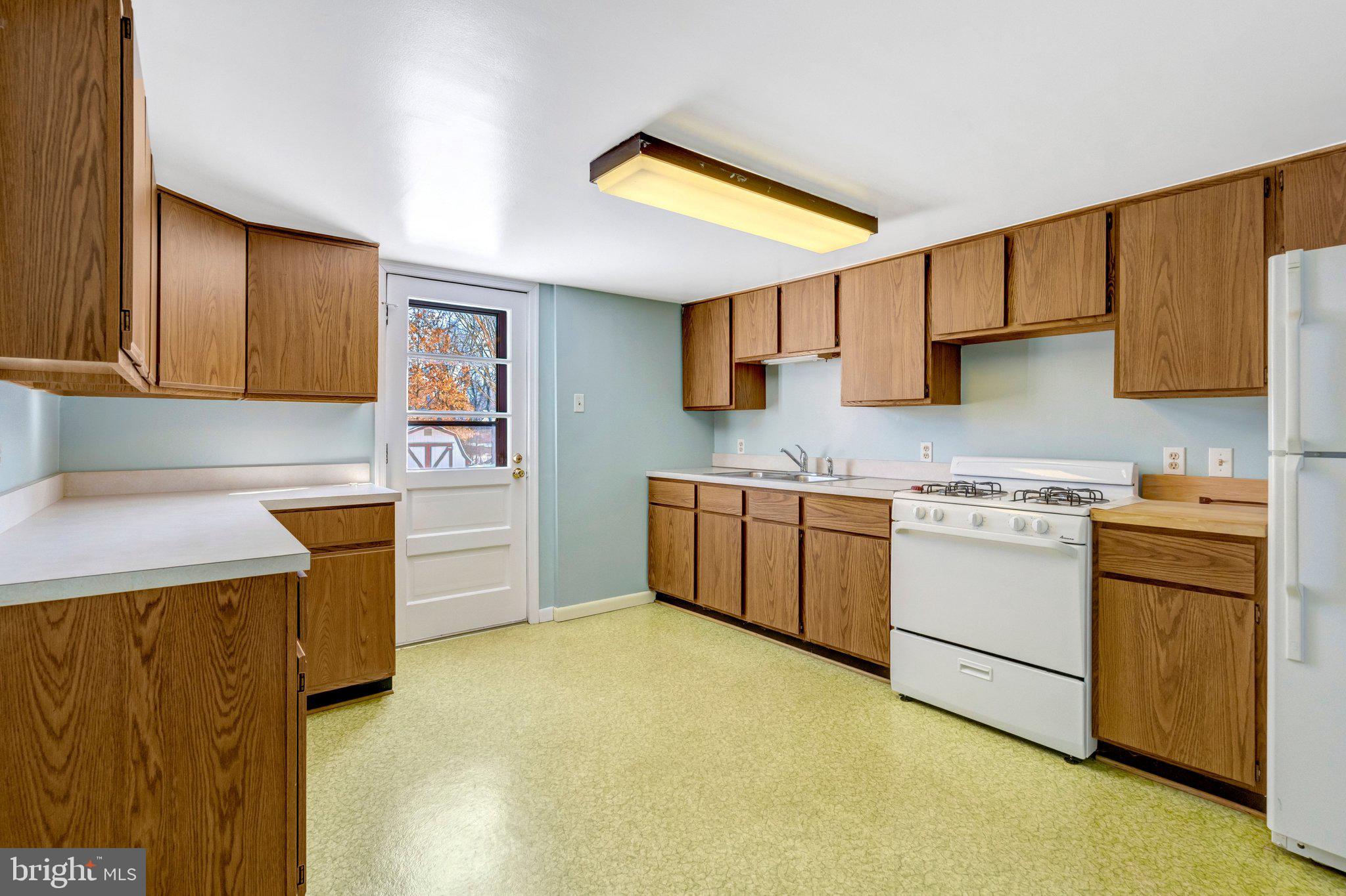 7413 Forrester Lane Manassas, VA 20109 - Photo 25 of 45 a kitchen with a stove top oven sink and cabinets