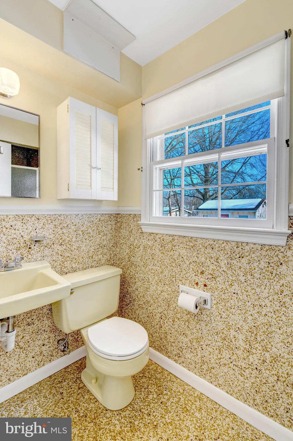 7413 Forrester Lane Manassas, VA 20109 - Photo 30 of 45 a bathroom with a toilet a sink and a window