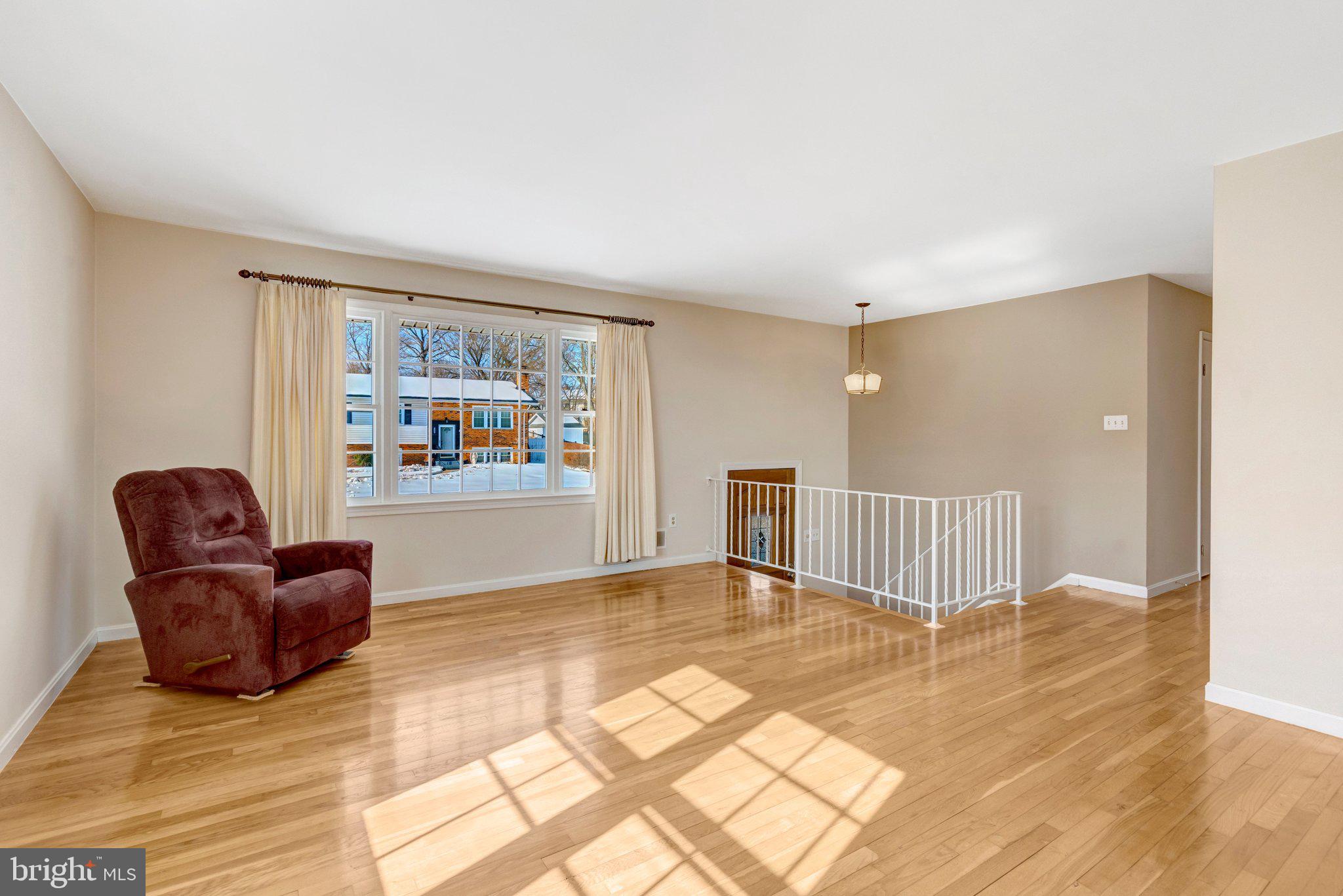 7413 Forrester Lane Manassas, VA 20109 - Photo 3 of 45 a living room with furniture and a rug