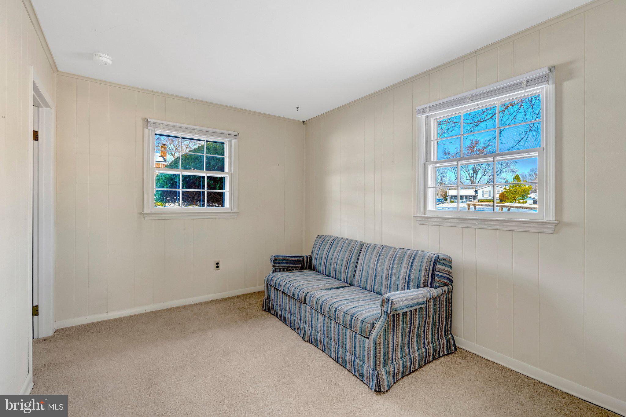 7413 Forrester Lane Manassas, VA 20109 - Photo 34 of 45 a living room with furniture and a window