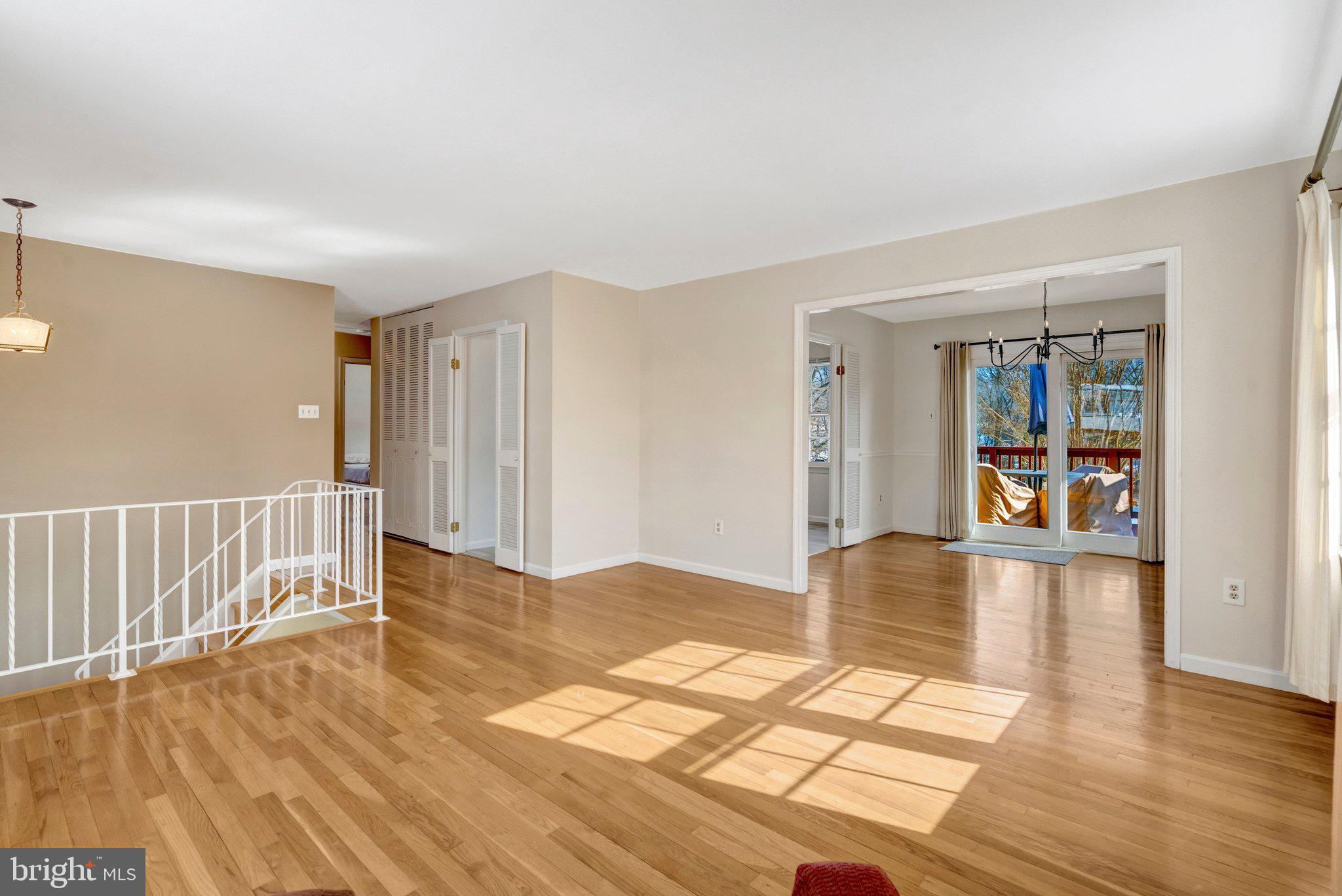 7413 Forrester Lane Manassas, VA 20109 - Photo 5 of 45 a view of empty room with wooden floor and fan