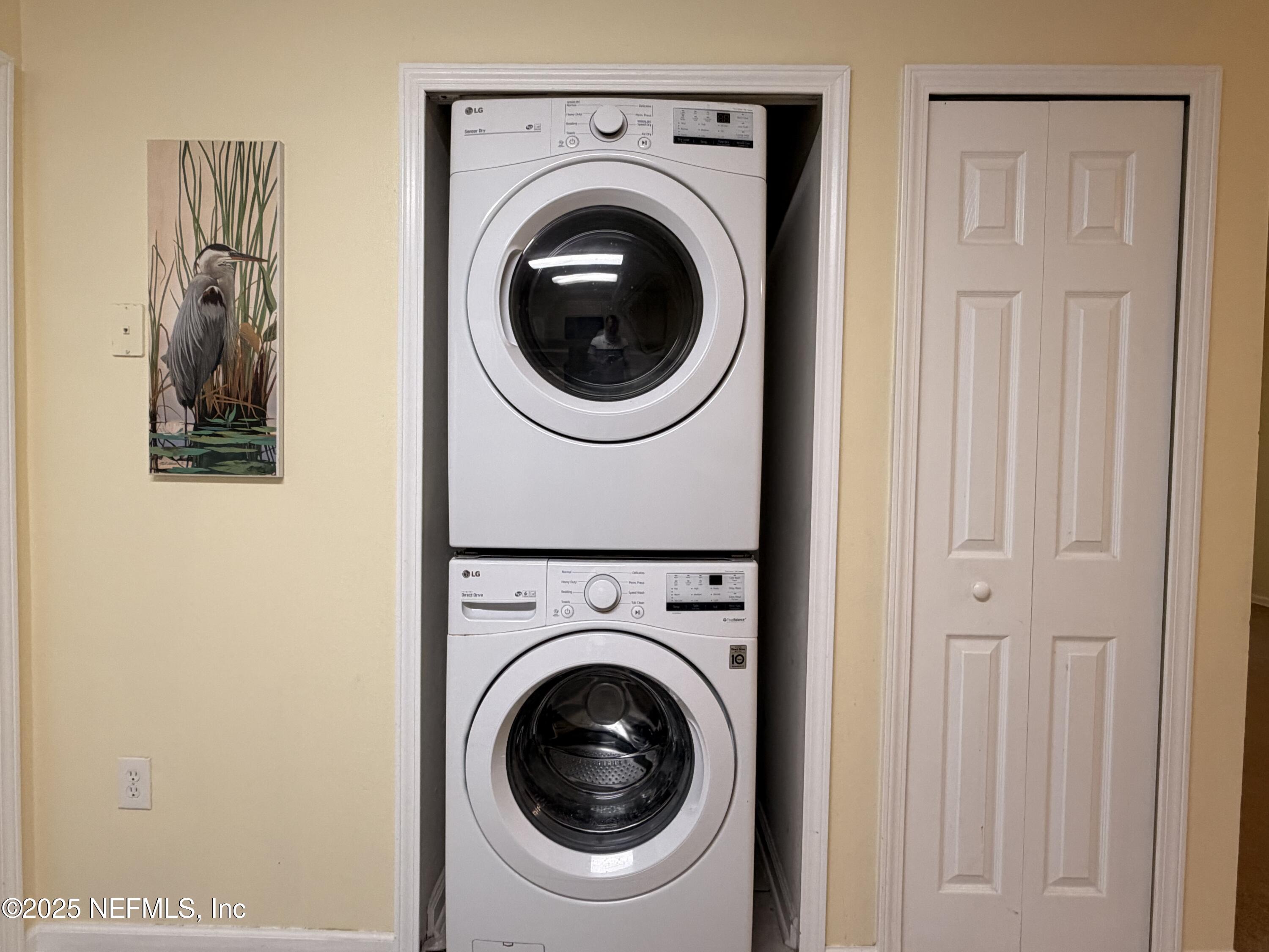 7920 Merrill Road, Unit 810 Jacksonville, FL 32277 - Photo 2 of 14 a utility room with dryer and washer