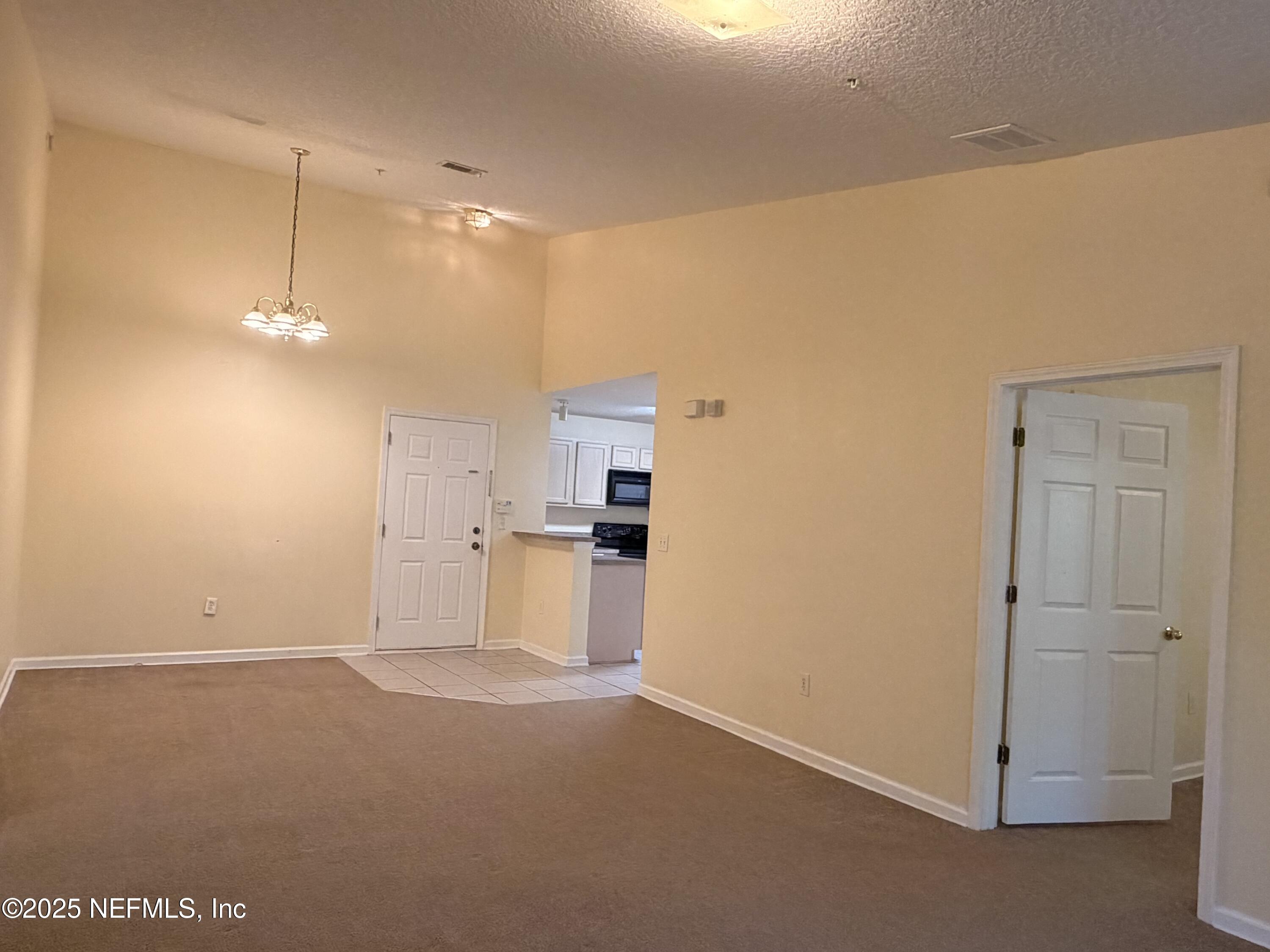 7920 Merrill Road, Unit 810 Jacksonville, FL 32277 - Photo 6 of 14 a view of a kitchen with a sink and cabinets