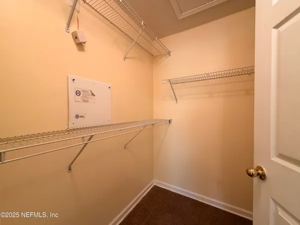 a view of a room with racks on the wall