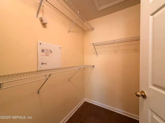 a view of a room with racks on the wall