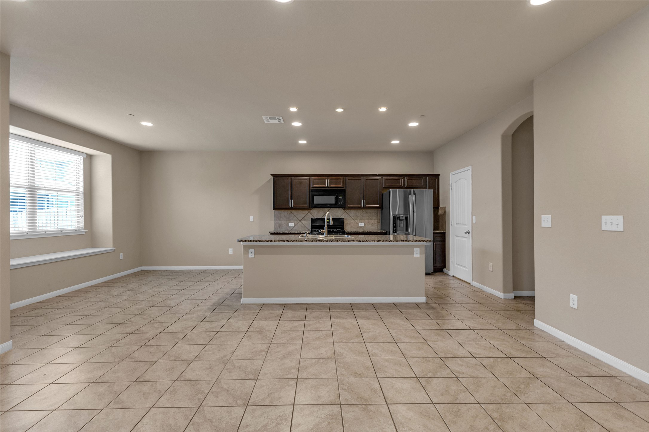 2880 Donnell Drive, Unit 2003 Round Rock, TX 78664 - Photo 5 of 31 Open-concept living space with large format tile flooring throughout