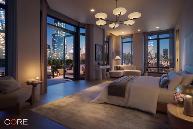 a room with lots of white furniture and a large window