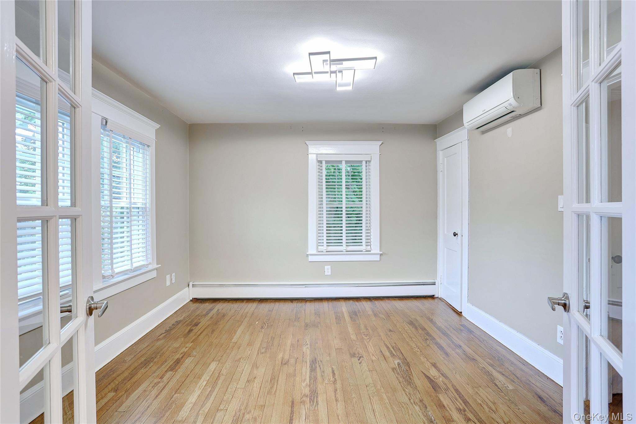 254 North Main Street New City, NY 10956 - Photo 8 of 37 an empty room with wooden floor and windows