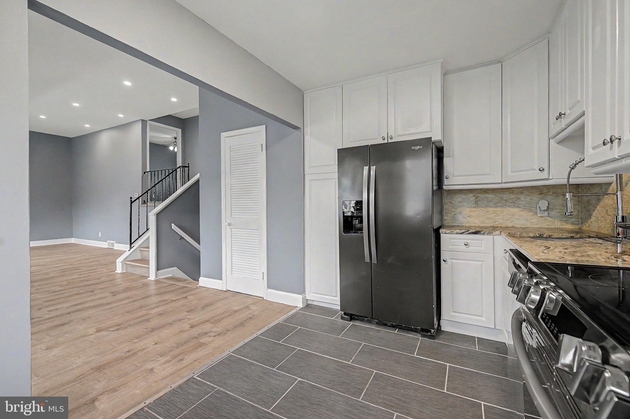 16 Malvern Road Newark, DE 19713 - Photo 11 of 35 a kitchen with stainless steel appliances granite countertop a refrigerator and a stove top oven