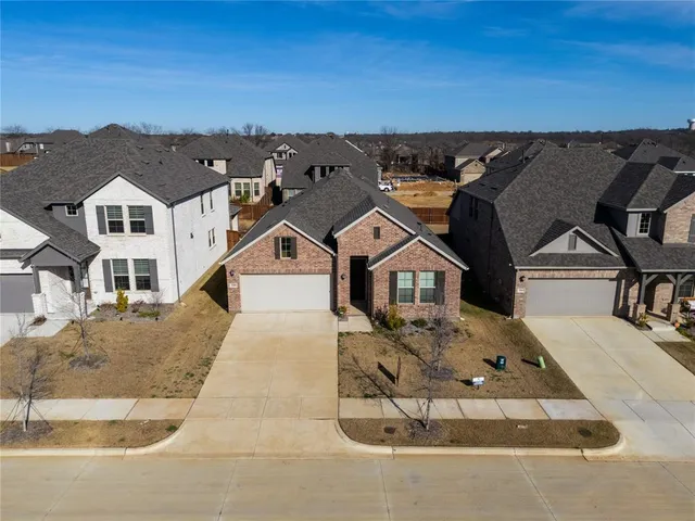 an aerial view of a house with a terrace