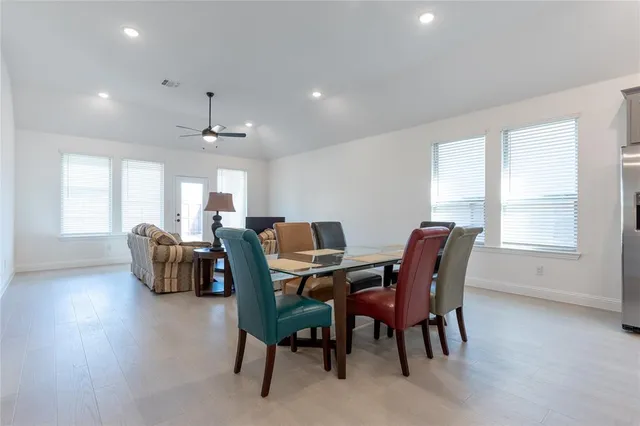 a view of a dining room with furniture and window