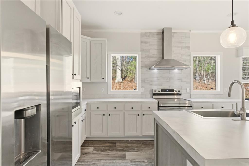 211 Loving Road Morganton, GA 30560 - Photo 21 of 34 a kitchen with granite countertop a sink stainless steel appliances and window