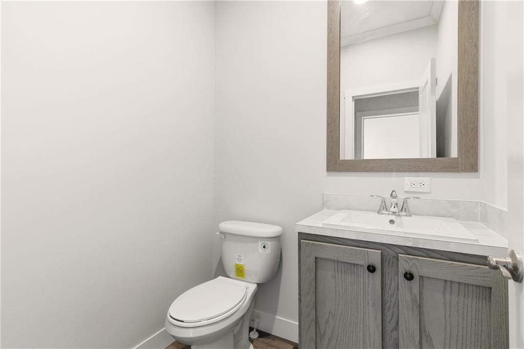 211 Loving Road Morganton, GA 30560 - Photo 22 of 34 a bathroom with a toilet sink and mirror