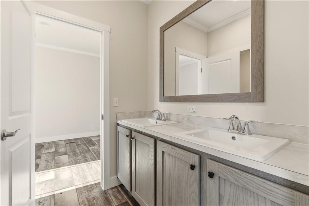 211 Loving Road Morganton, GA 30560 - Photo 25 of 34 a bathroom with a sink and a mirror