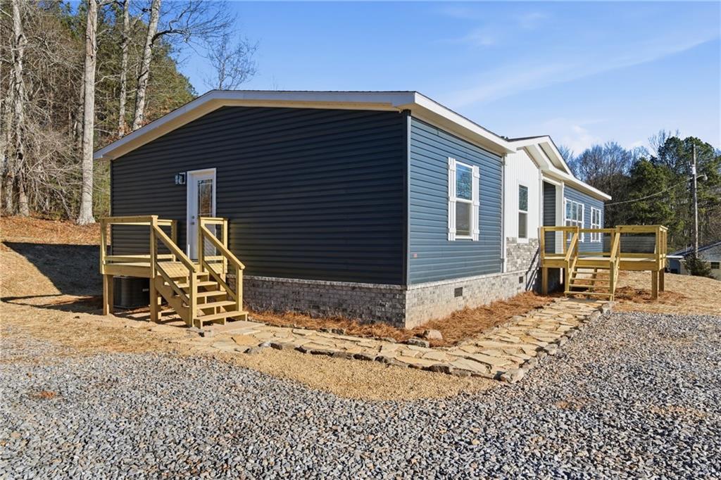 211 Loving Road Morganton, GA 30560 - Photo 3 of 34 a front view of a house with yard