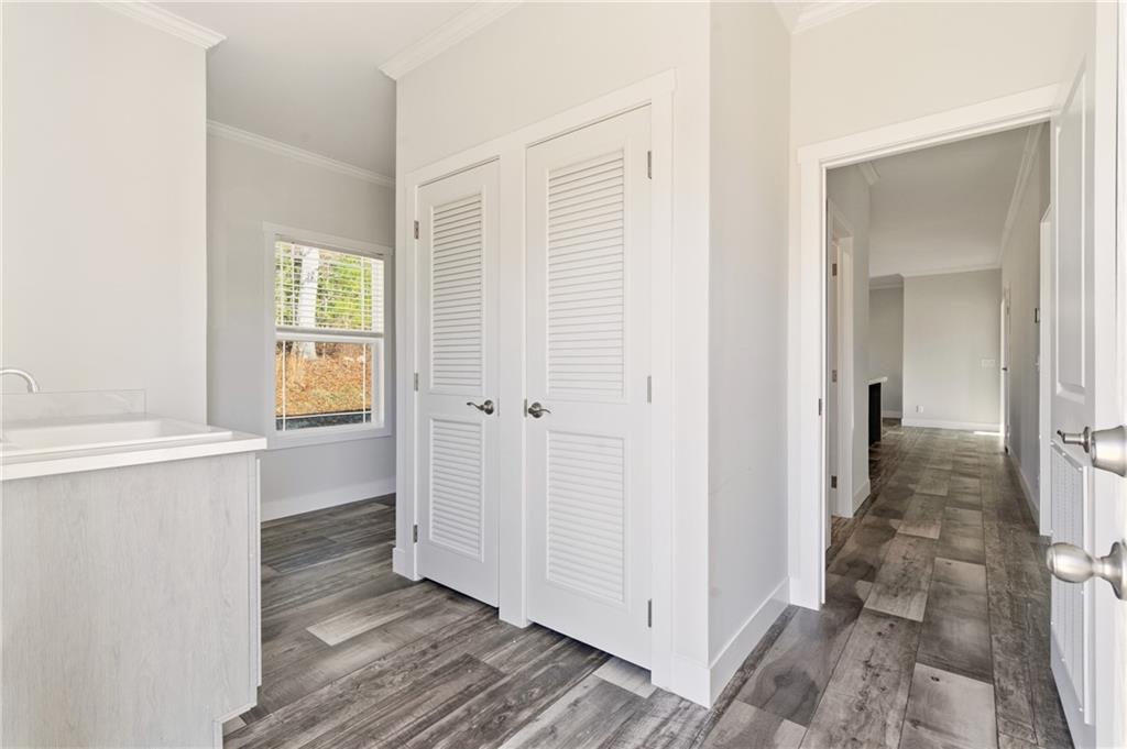 211 Loving Road Morganton, GA 30560 - Photo 32 of 34 a view of a hallway with wooden floor and a bathroom