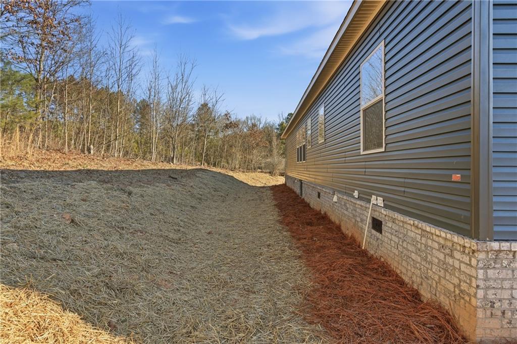 211 Loving Road Morganton, GA 30560 - Photo 34 of 34 a view of a house with a yard