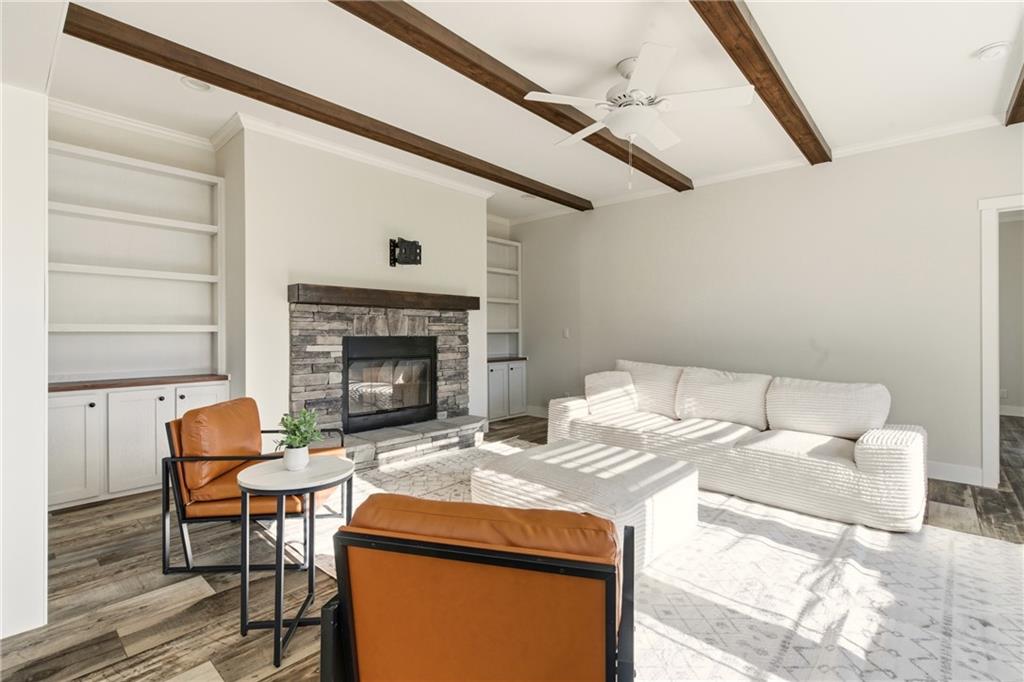 211 Loving Road Morganton, GA 30560 - Photo 7 of 34 a living room with furniture and a fireplace