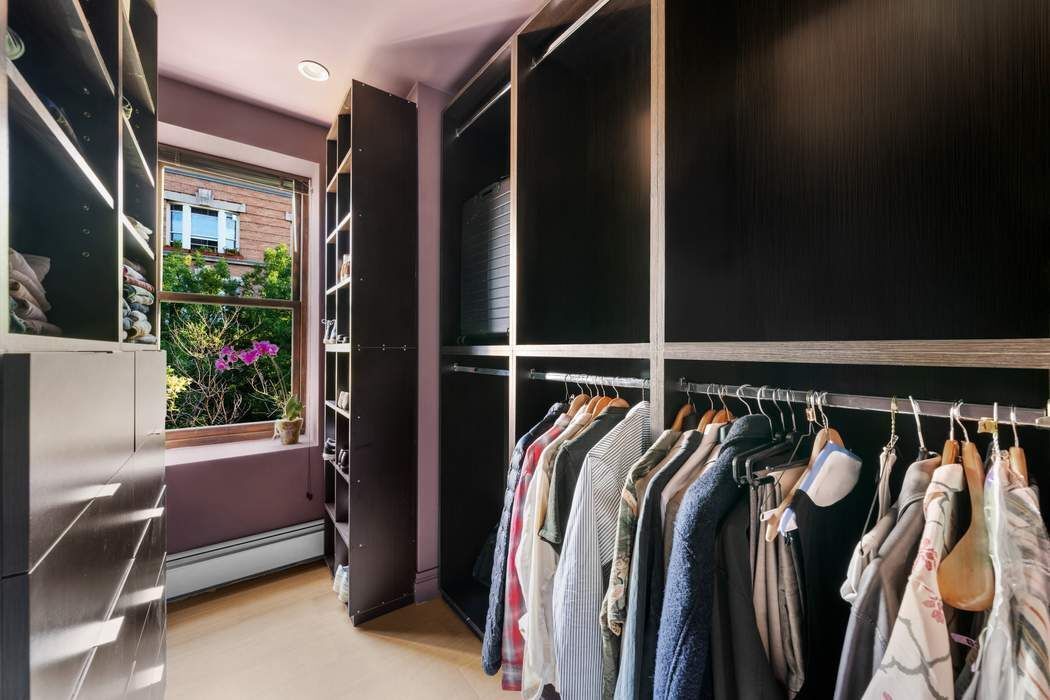 721 St Nicholas Avenue, Unit PH4 Manhattan, NY 10031 - Photo 10 of 17 a view of walk in closet with clothes and shoes