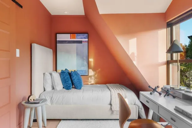 a bedroom with a bed and window