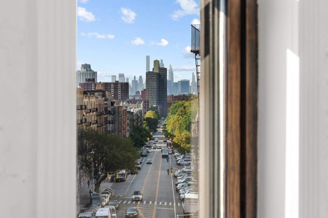 721 St Nicholas Avenue, Unit PH4 Manhattan, NY 10031 - Photo 4 of 17 a view of a city from a corridor