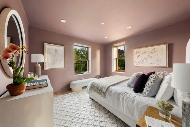 a bedroom with bed and a window