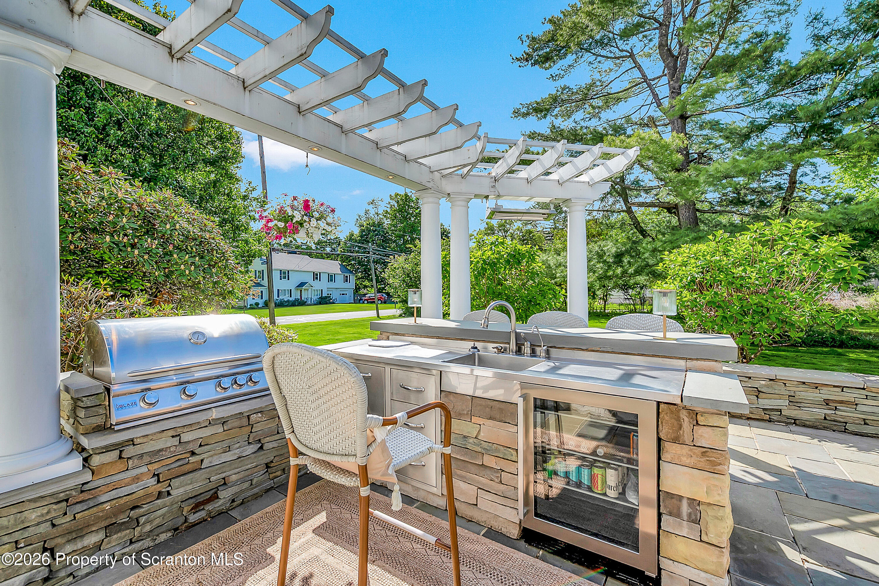 330 Glenburn Road Clarks Green, PA 18411 - Photo 7 of 69 a view of a patio with table and chairs potted plants with wooden floor and large tree