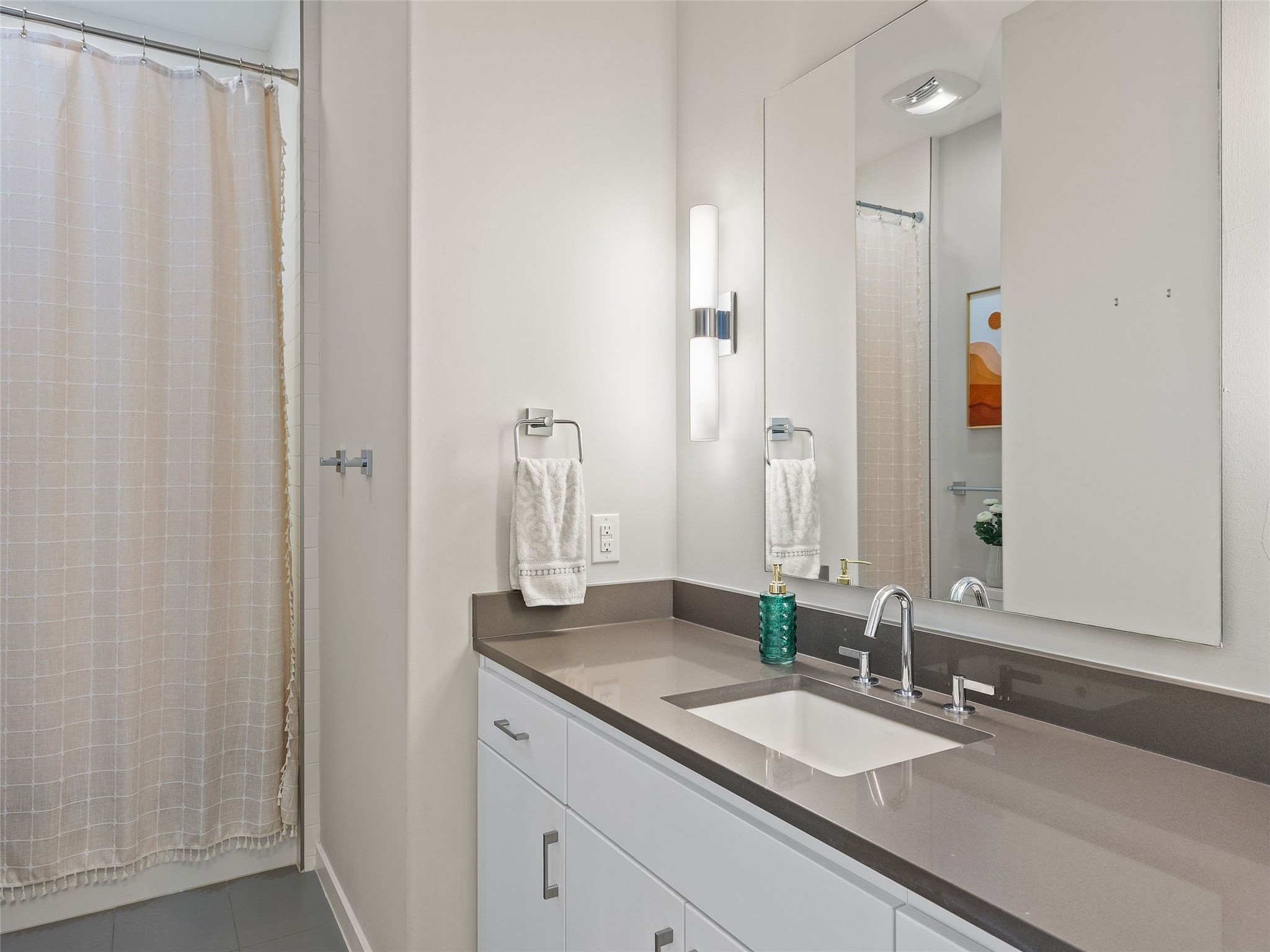 5921 Hiline Road, Unit 1303 Austin, TX 78734 - Photo 23 of 37 a bathroom with a double vanity sink and a mirror