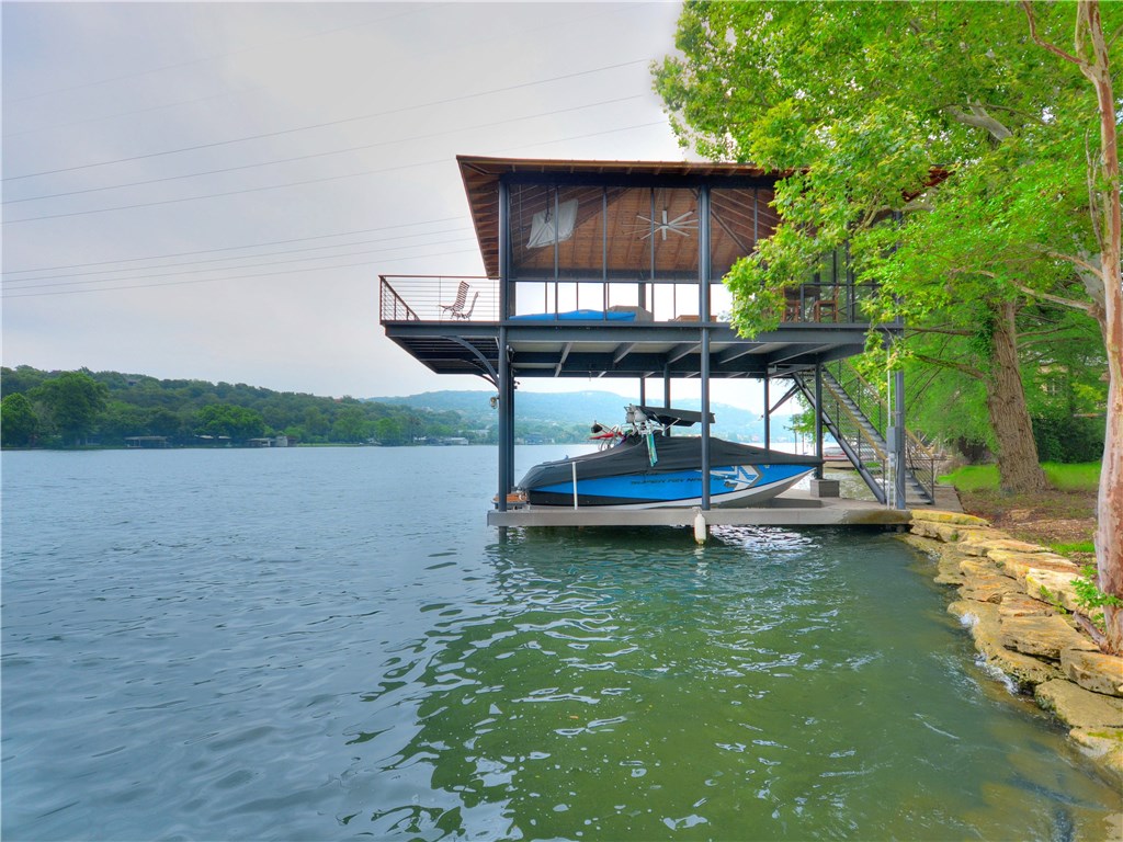 a backyard of a house with yard and outdoor seating