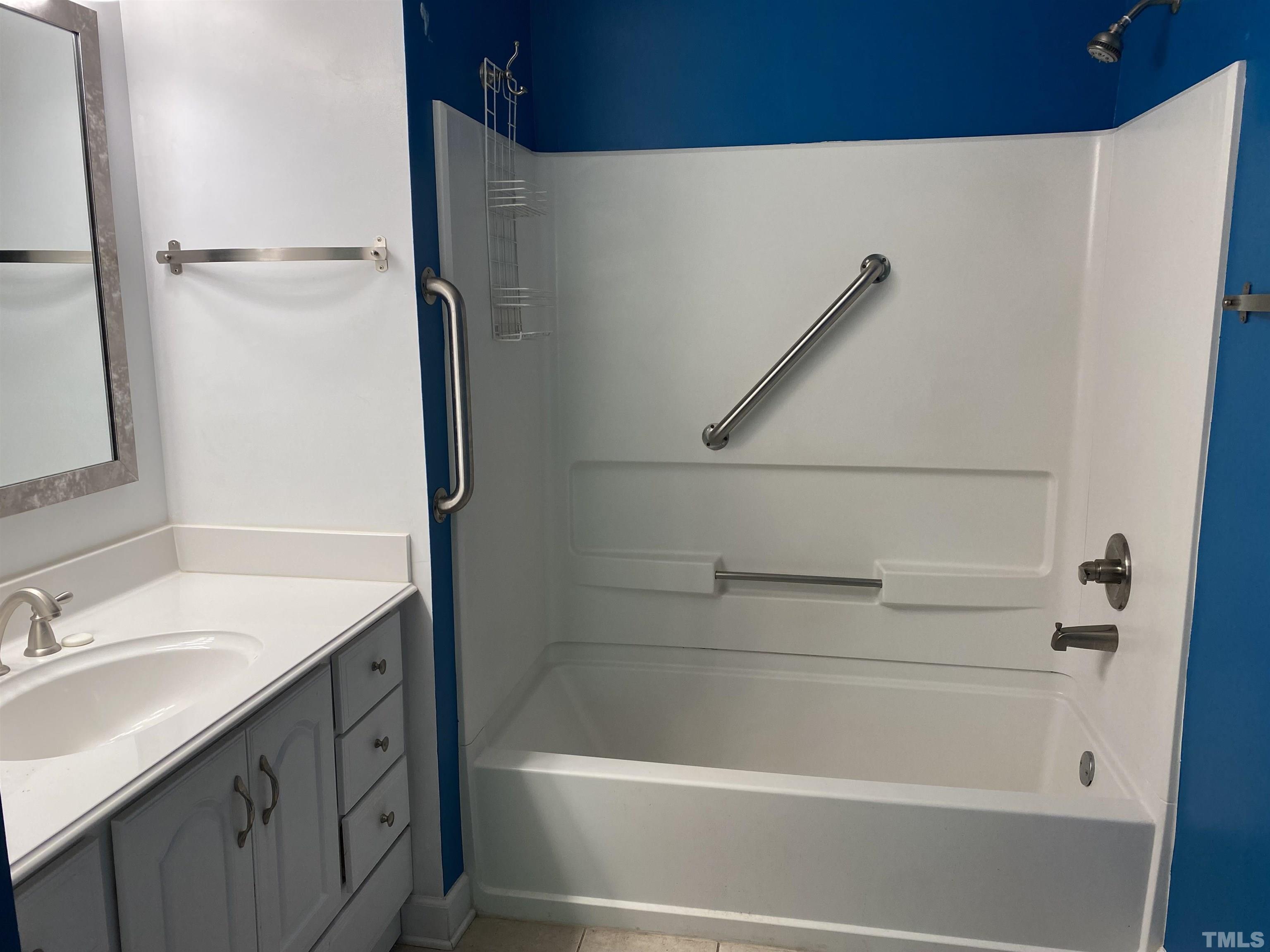 116 Baldwin Drive Durham, NC 27712 - Photo 11 of 33 a bathroom with a sink a mirror and a bathtub